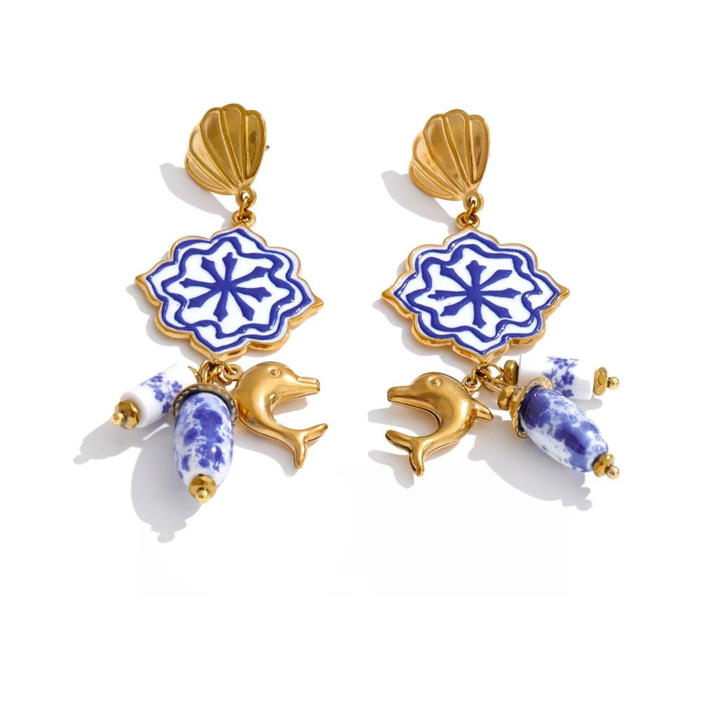 Gold-plated stainless steel earrings with blue enamel and shell detailing in an icy blue tone