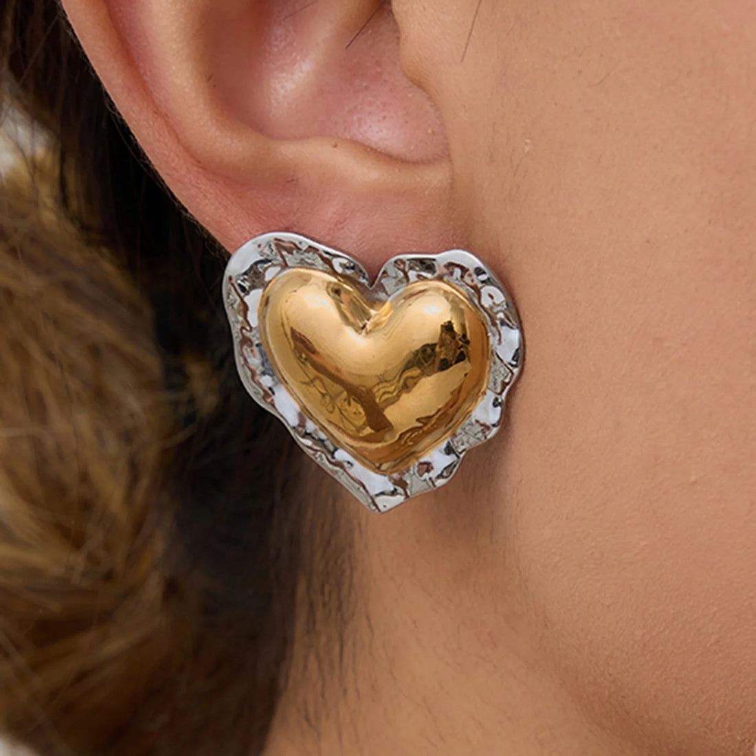 Two-tone puffy heart earrings with a rounded silhouette