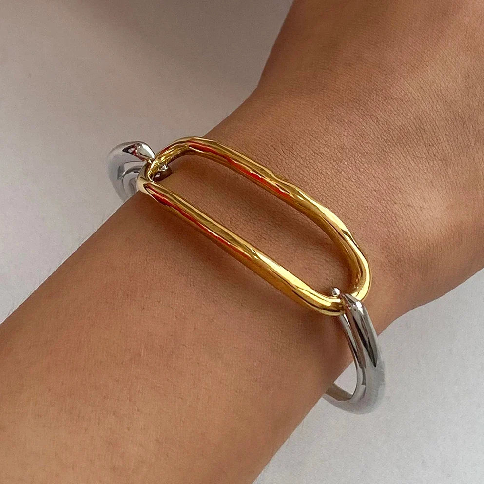 Two-tone oval-link cuff bracelet as a single wrist accent