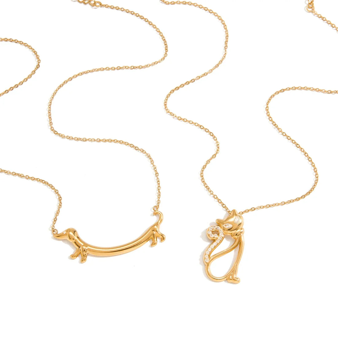 Crystal dog and cat pendant necklace stored on its own hook to stay tangle-free
