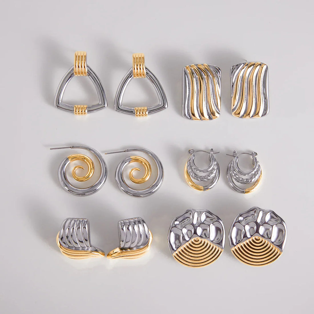 Sculptural silver-tone stainless steel earrings styled as an everyday alternative to sterling silver