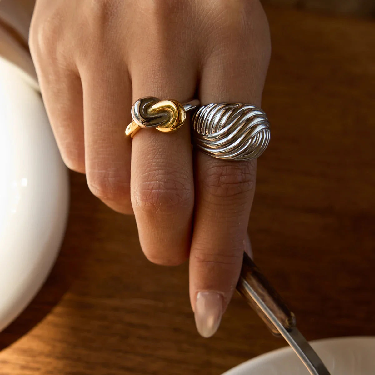 Two-tone gold and silver stainless steel ring stack for mixed metal styling