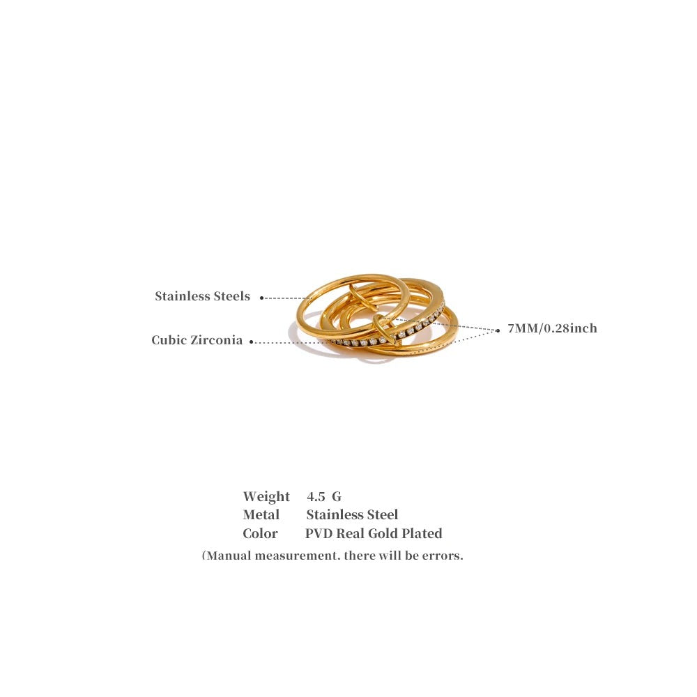 Cubic zirconia geometric layered ring in 18K gold-plated stainless steel with cubic zirconia.