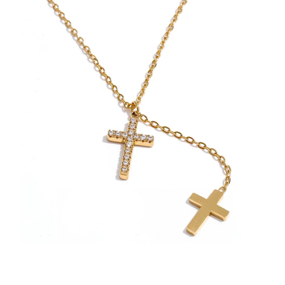 Gold-plated stainless steel cross necklace with cubic zirconia.