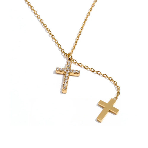 Gold-plated stainless steel cross necklace with cubic zirconia.