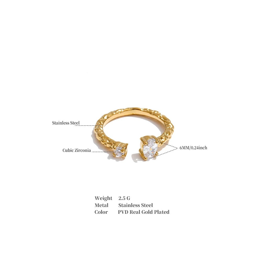 Cubic zirconia geometric ring in 18K gold-plated stainless steel with cubic zirconia.