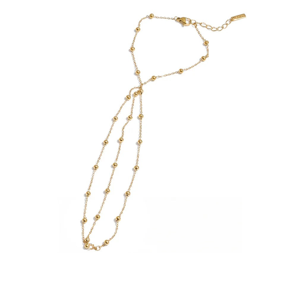 Gold-plated stainless steel bracelet with a long chain.