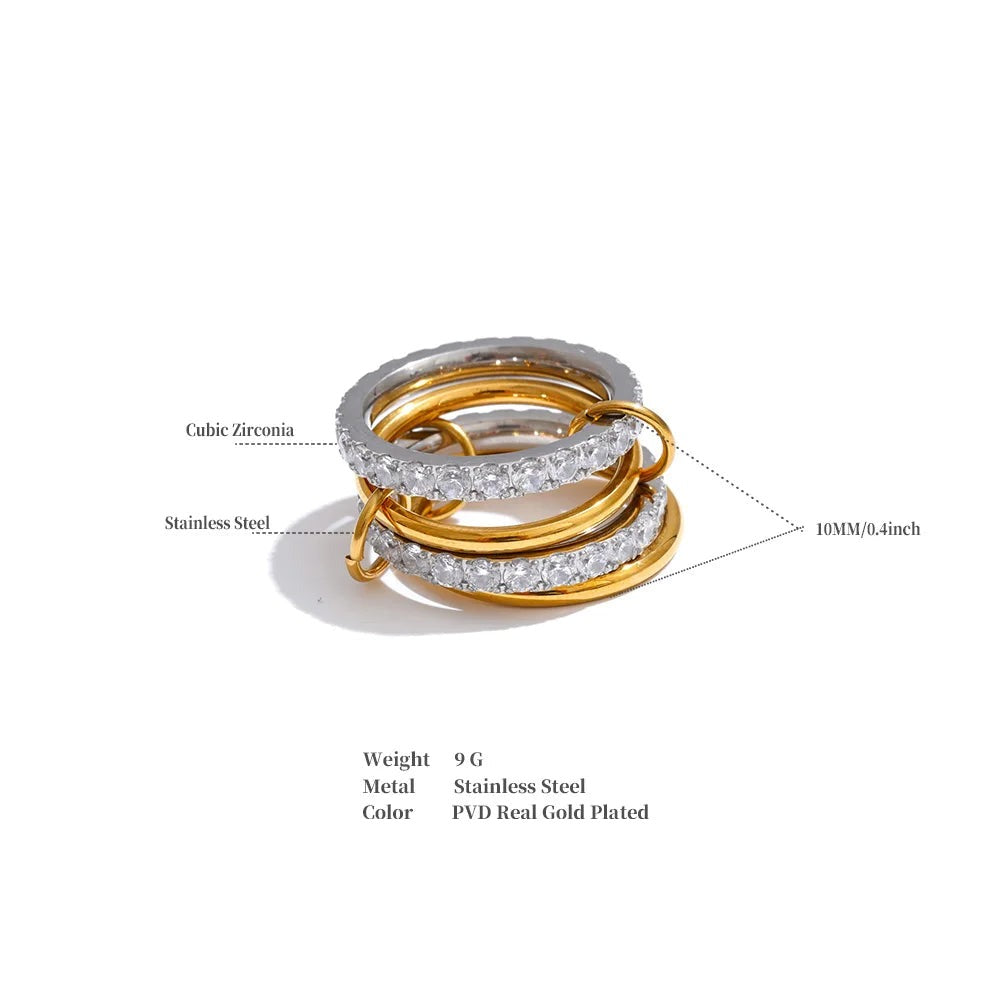 Cubic zirconia geometric layered ring in 18K gold-plated stainless steel with cubic zirconia.