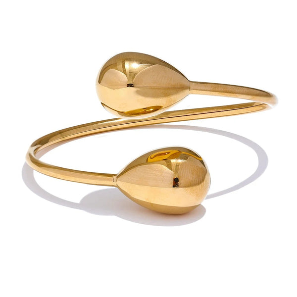 Gold-plated stainless steel bracelet featuring two spherical charms.