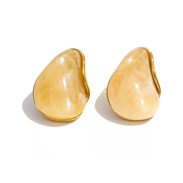 Gold-plated stainless steel earrings with resin and acrylic.