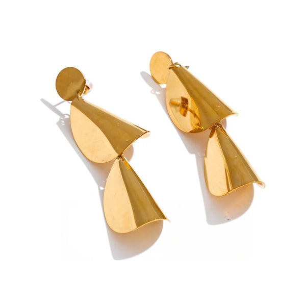 Gold earrings with a unique design featuring two curved shapes resembling leaves.