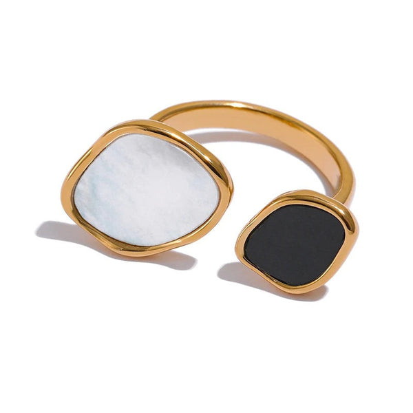 Gold-plated ring with shell and acrylic designs.