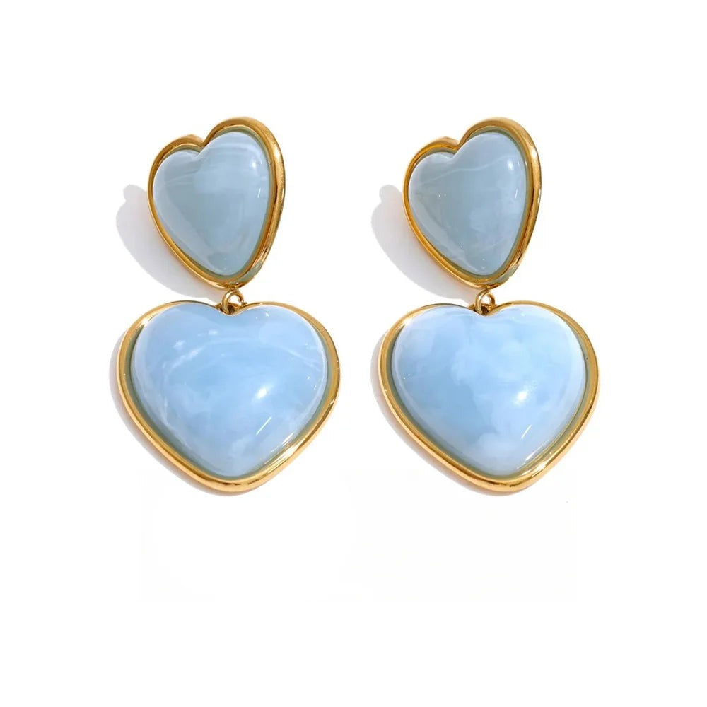 Gold-plated stainless steel earrings with blue resin hearts.