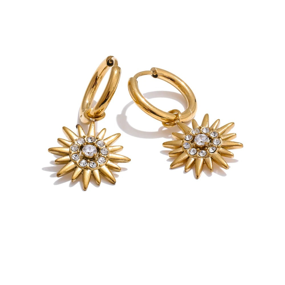 Gold-plated stainless steel earrings with cubic zirconia suns.