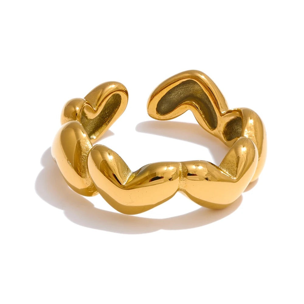 Gold-plated stainless steel ring featuring a heart shape on one side.