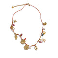Gold-plated necklace with natural stone and shell accents.