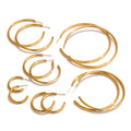 Gold-plated stainless steel hoop earrings.