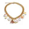 Gold-plated stainless steel necklace with floral embellishments and a chain.