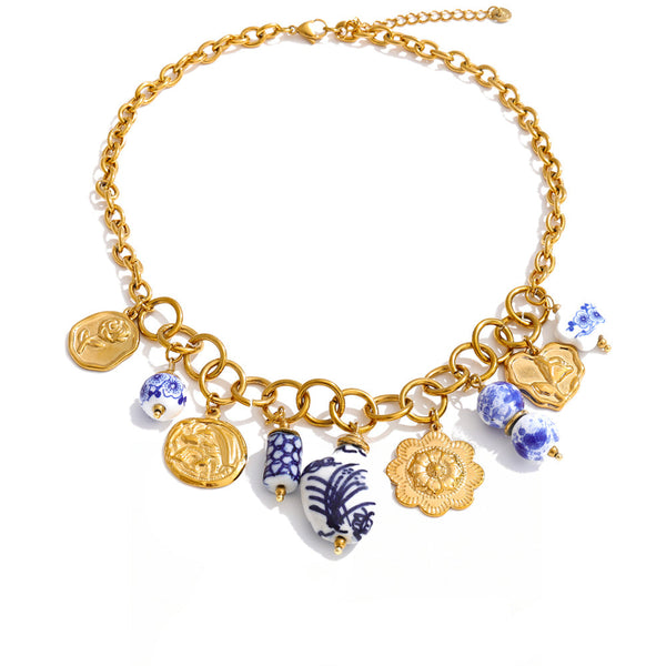 Gold-plated stainless steel necklace with blue and white beads.