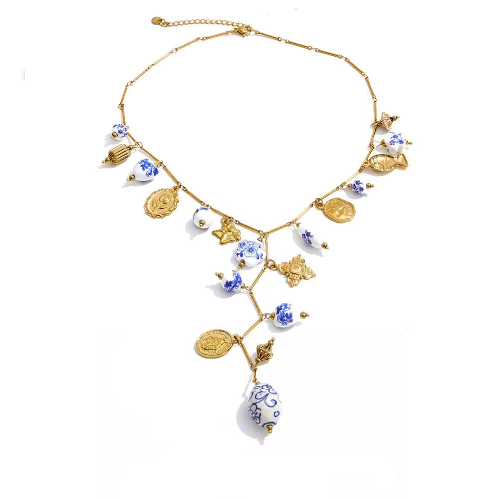 Gold-plated stainless steel necklace with blue accents and a pendant featuring a floral design.