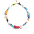 Gold-plated necklace with natural stones and shells.