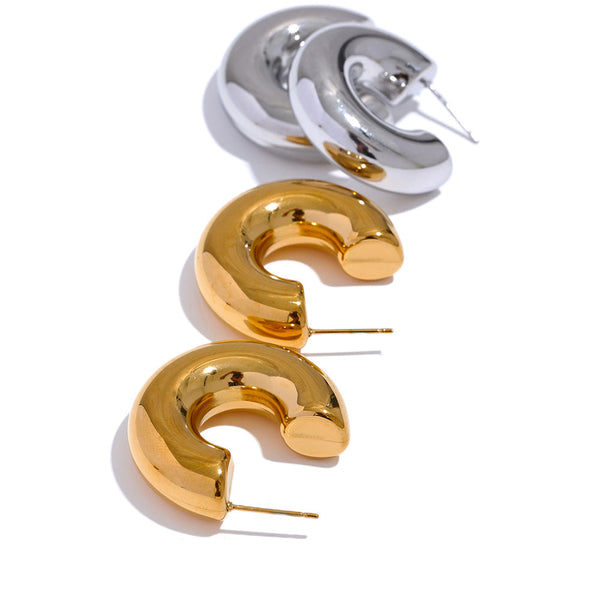 Gold-plated stainless steel earrings with a unique curved design.