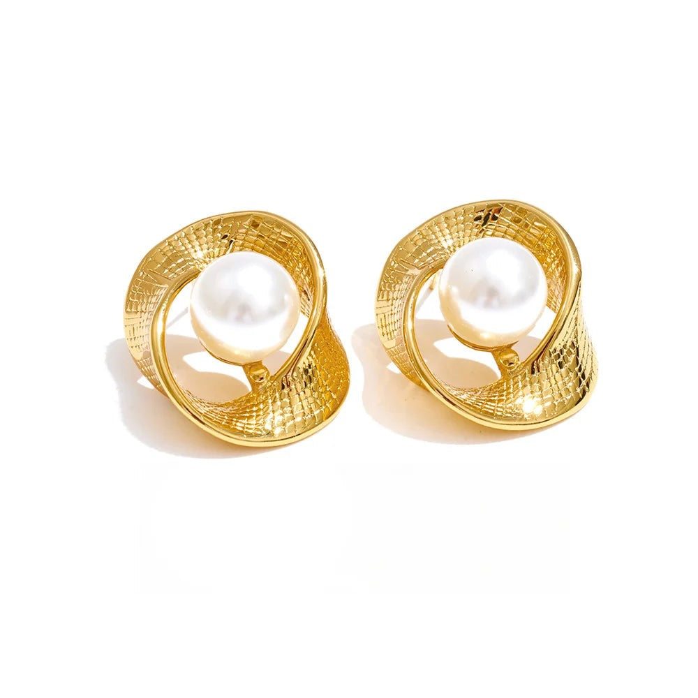 Gold-plated pearl earrings with a unique design.