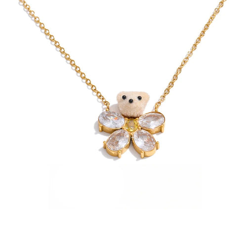 Gold-plated stainless steel necklace with cubic zirconia flower pendant.
