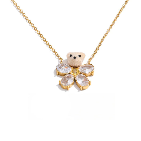 Gold-plated stainless steel necklace with cubic zirconia flower pendant.