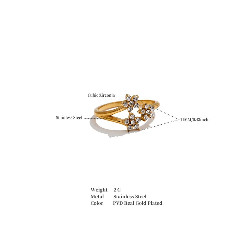 Cubic zirconia flower ring in 18K gold-plated stainless steel with cubic zirconia.