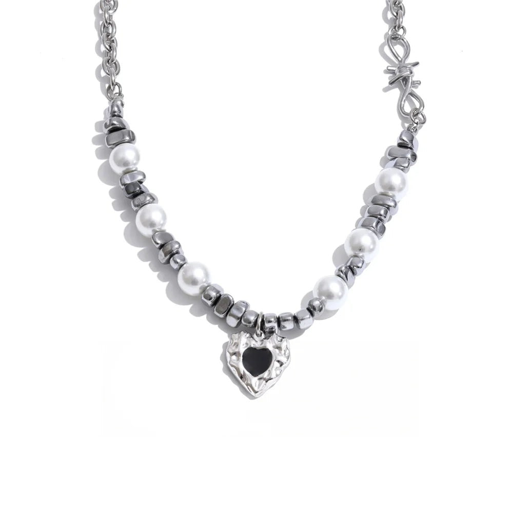 Gold-plated stainless steel necklace with pearl and a heart charm.