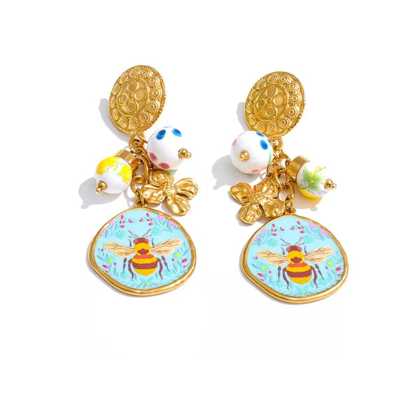 Gold-plated stainless steel earrings featuring a bee design with a floral pattern and a small honeycomb charm.