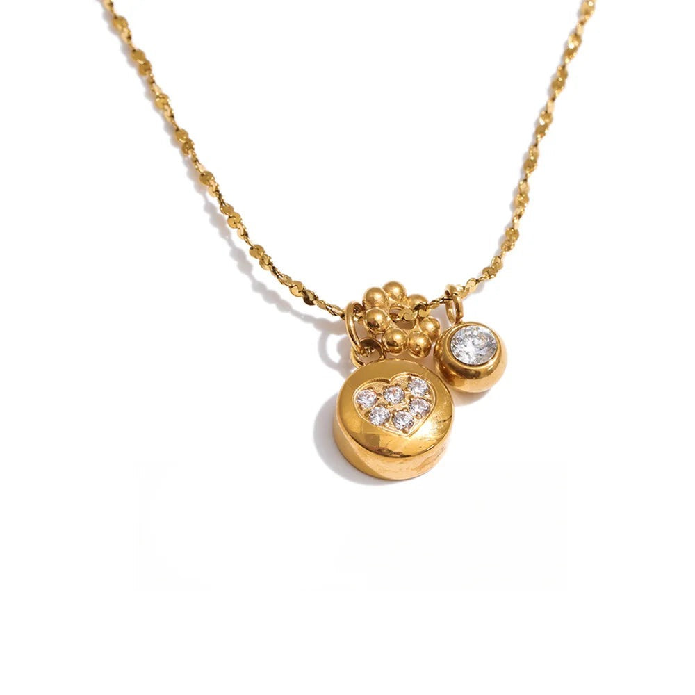 Gold-plated stainless steel necklace with cubic zirconia charms.