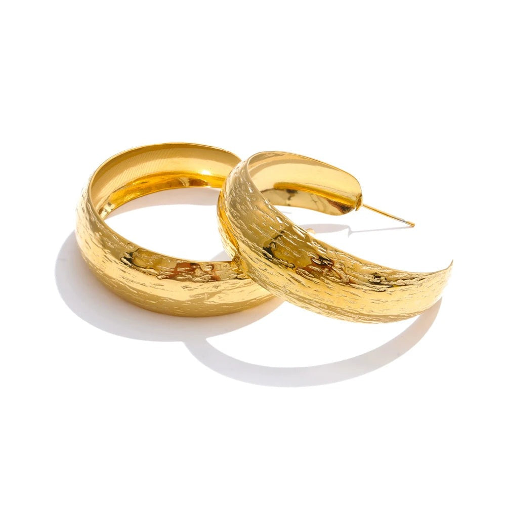 Gold-plated stainless steel earrings with a large hoop design.