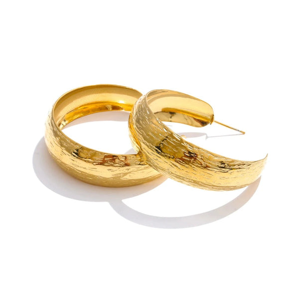 Gold-plated stainless steel earrings with a large hoop design.