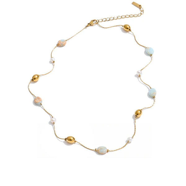 Gold-plated stainless steel necklace with pearl and natural stone beads.