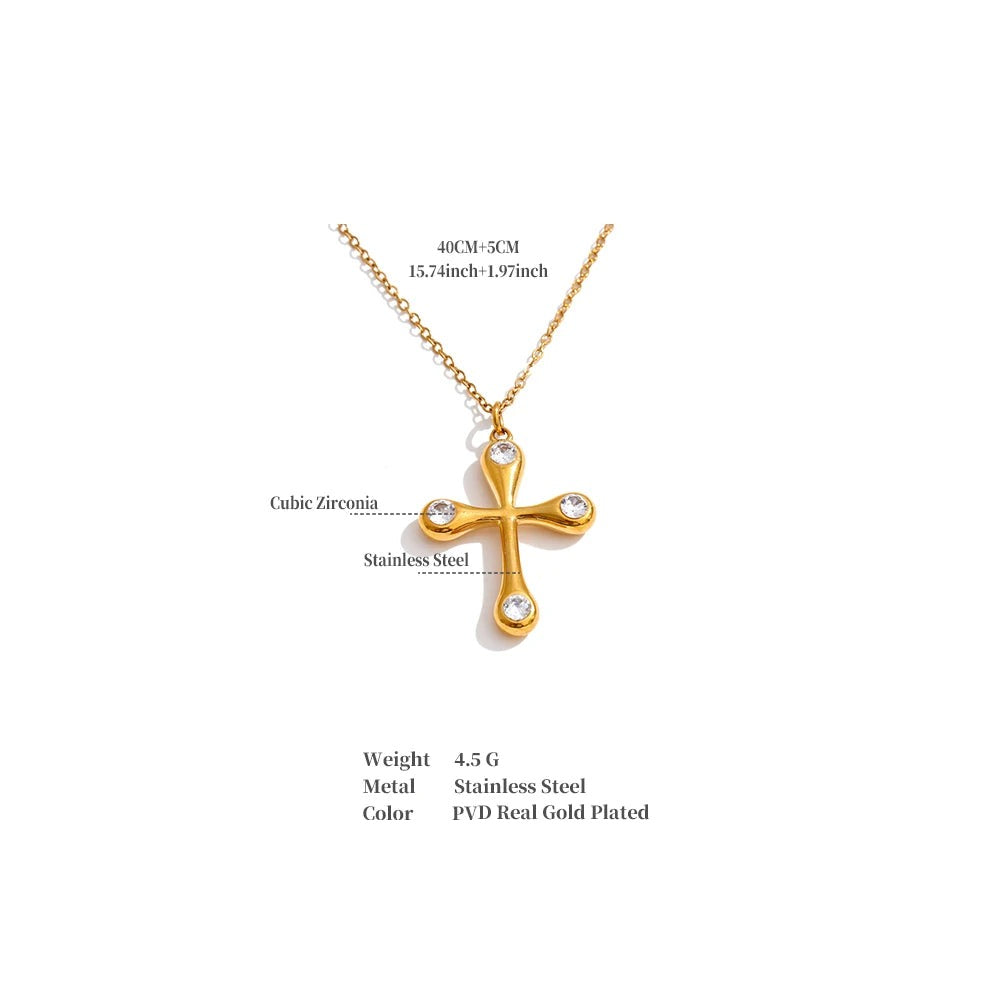Cubic zirconia cross necklace in gold-plated stainless steel with cubic zirconia.