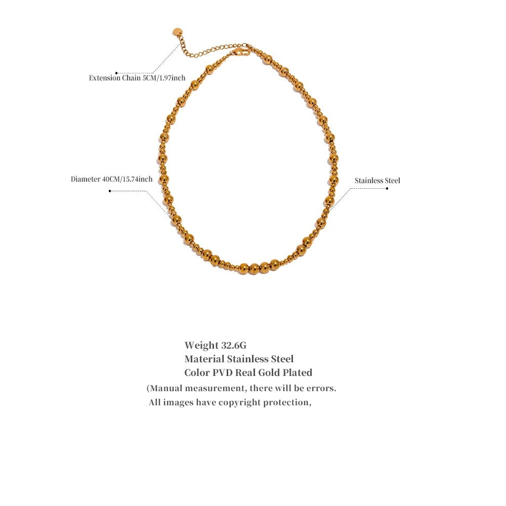 Beaded geometric chain necklace in gold-plated stainless steel.