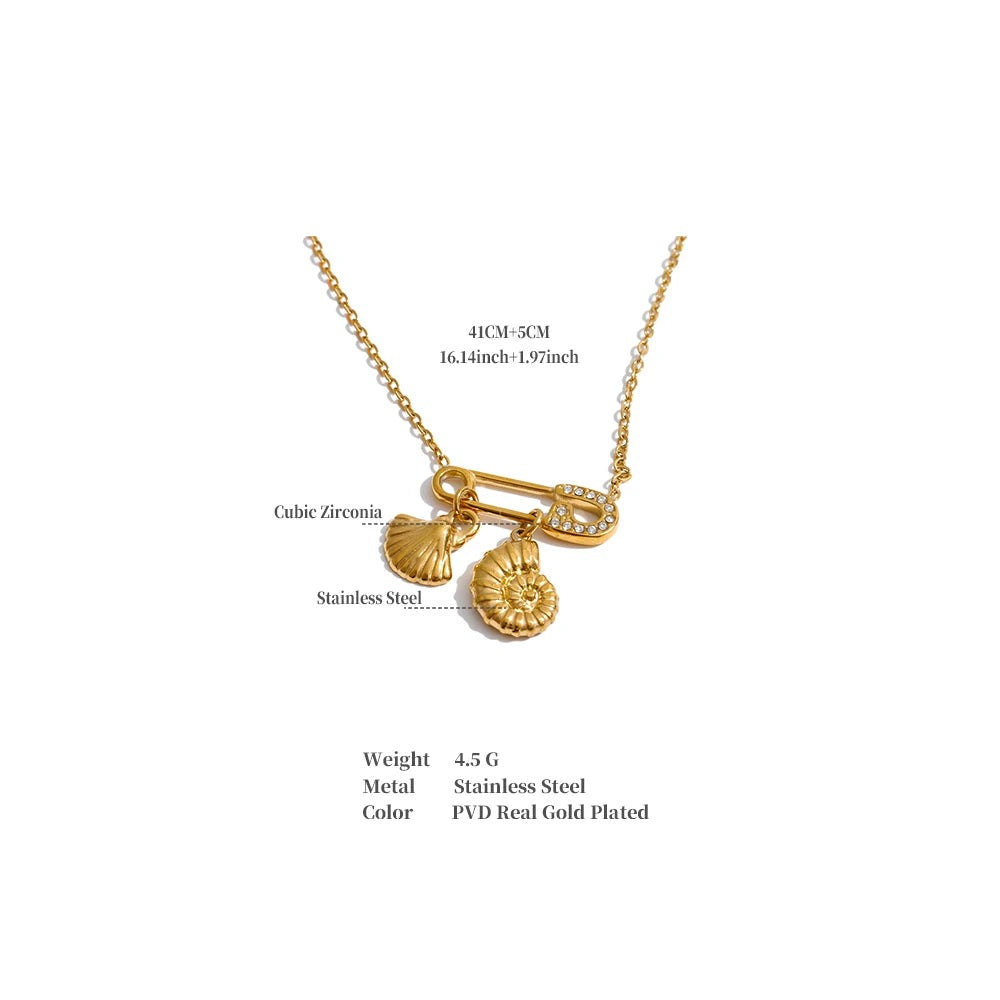 Cubic zirconia shell geometric necklace in gold-plated stainless steel with cubic zirconia and shell.