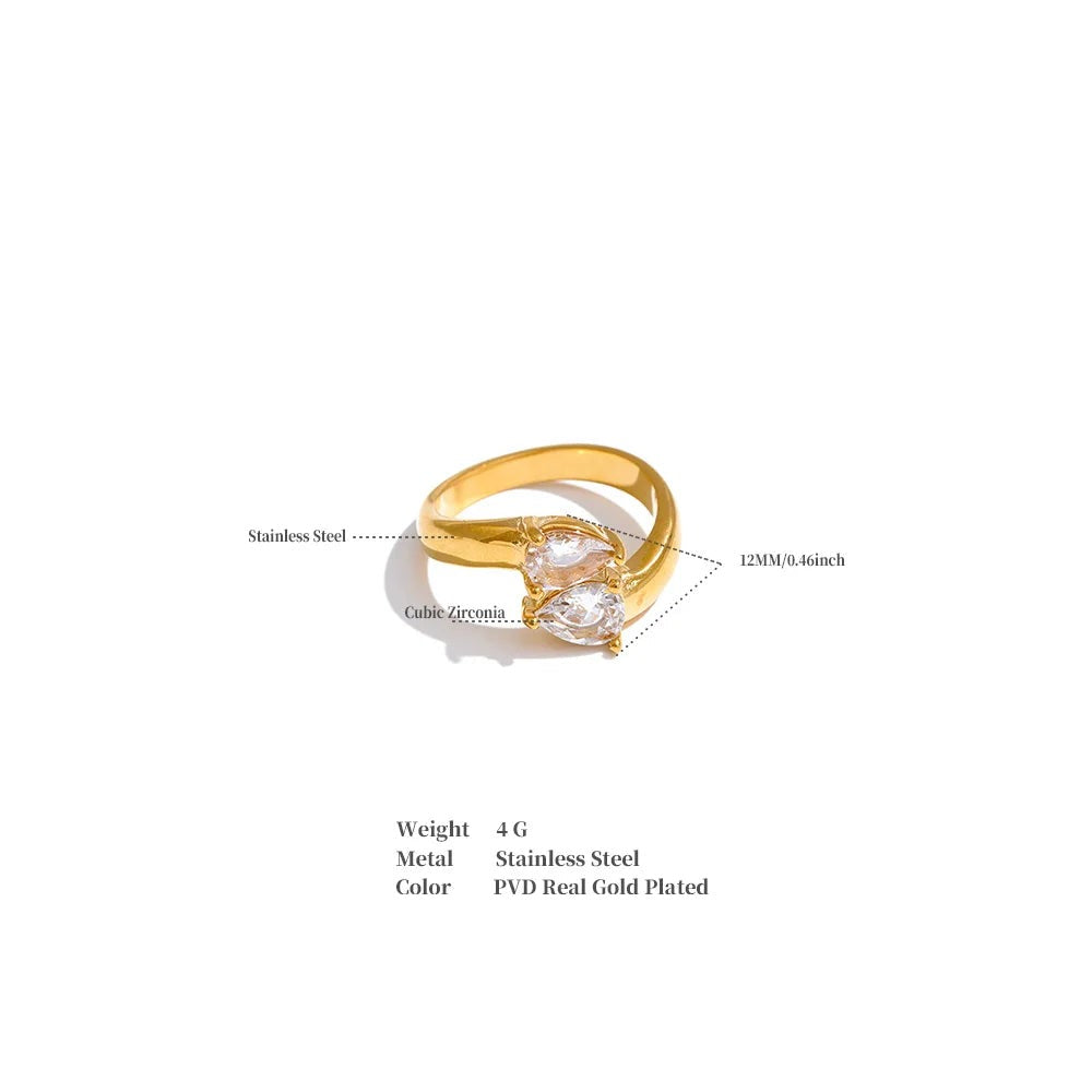 Cubic zirconia geometric ring in 18K gold-plated stainless steel with cubic zirconia.
