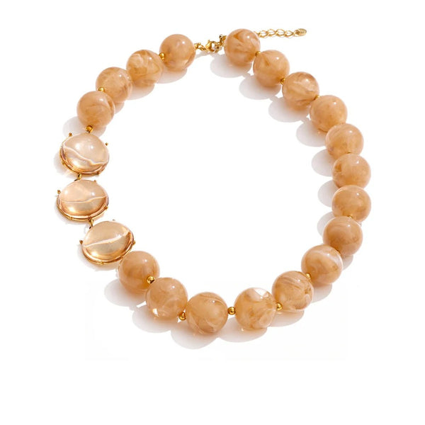 Gold-plated stainless steel necklace with resin and acrylic stones.