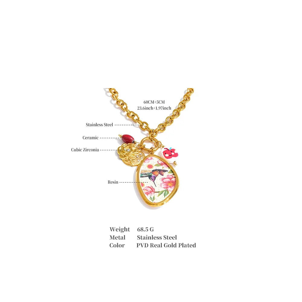 Cubic zirconia resin flower necklace in gold-plated stainless steel with cubic zirconia and resin.