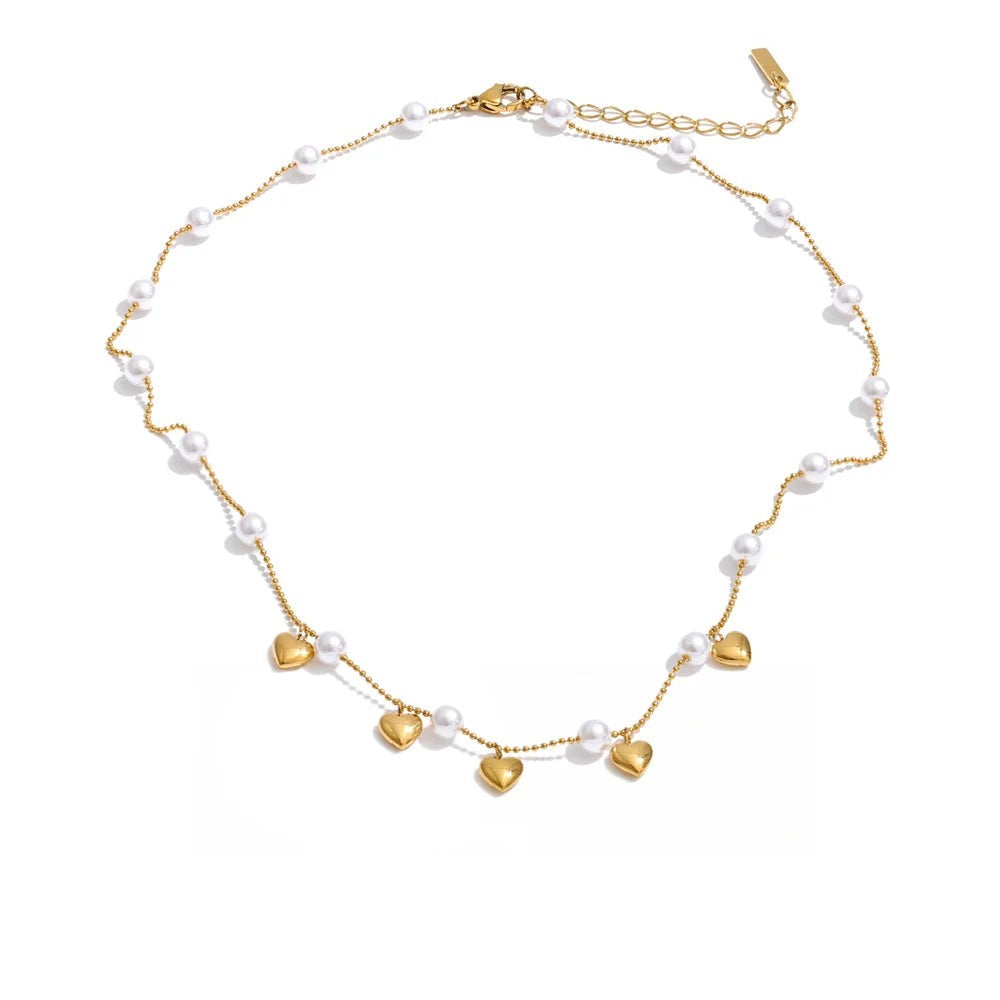 Gold-plated pearl necklace with a heart pendant.