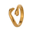 Gold-plated ring featuring a unique design resembling two hands clasped together.