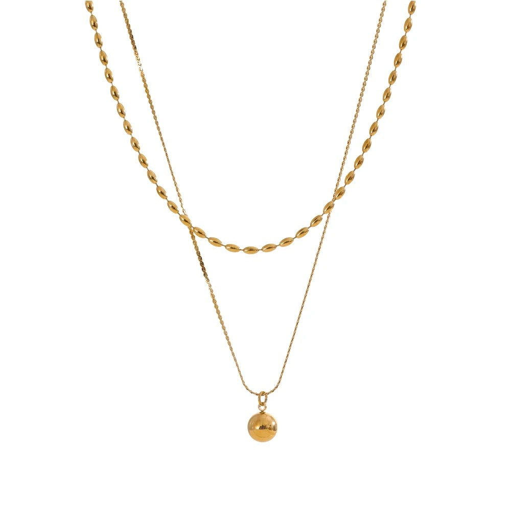 Gold-plated stainless steel necklace with a small gold pendant.