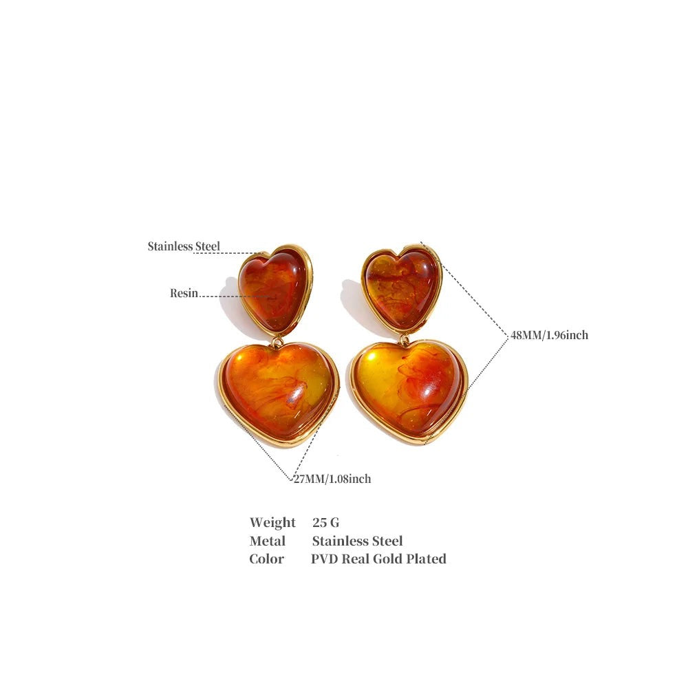 Resin acrylic heart earrings in gold-plated stainless steel with resin and acrylic.
