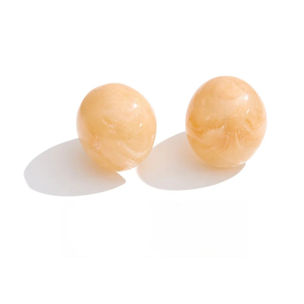 Gold resin earrings with a smooth finish.