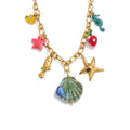 Gold-plated necklace featuring a variety of shells, enamel accents, and colorful fish charms.
