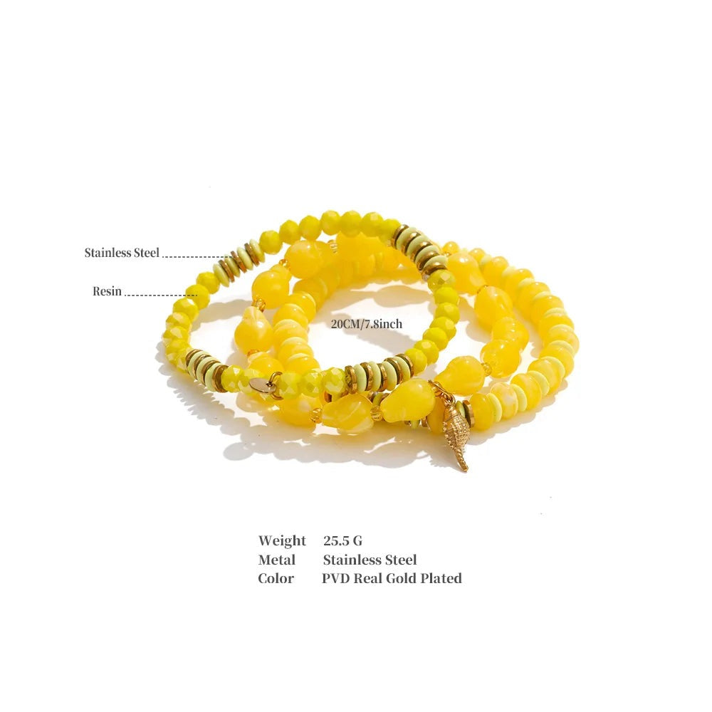 Resin acrylic beaded necklace in gold-plated stainless steel with resin and acrylic.