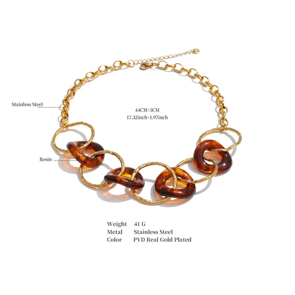 Resin acrylic geometric necklace in gold-plated stainless steel with resin and acrylic.